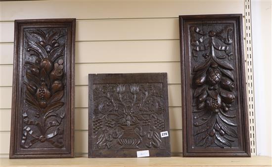 A 19th century carved oak panel and two later oak panels